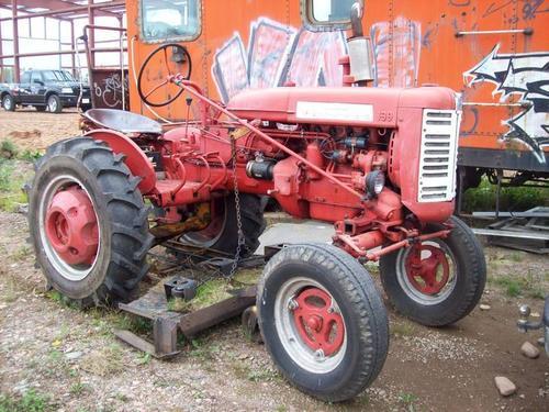 1957_Farmall_130_Tractor_With_A_Woods_Rotery_Belly_Mower